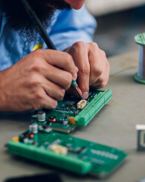 electronics-engineer-working-in-a-workshop-with-ti-2022-11-18-20-08-09-utc